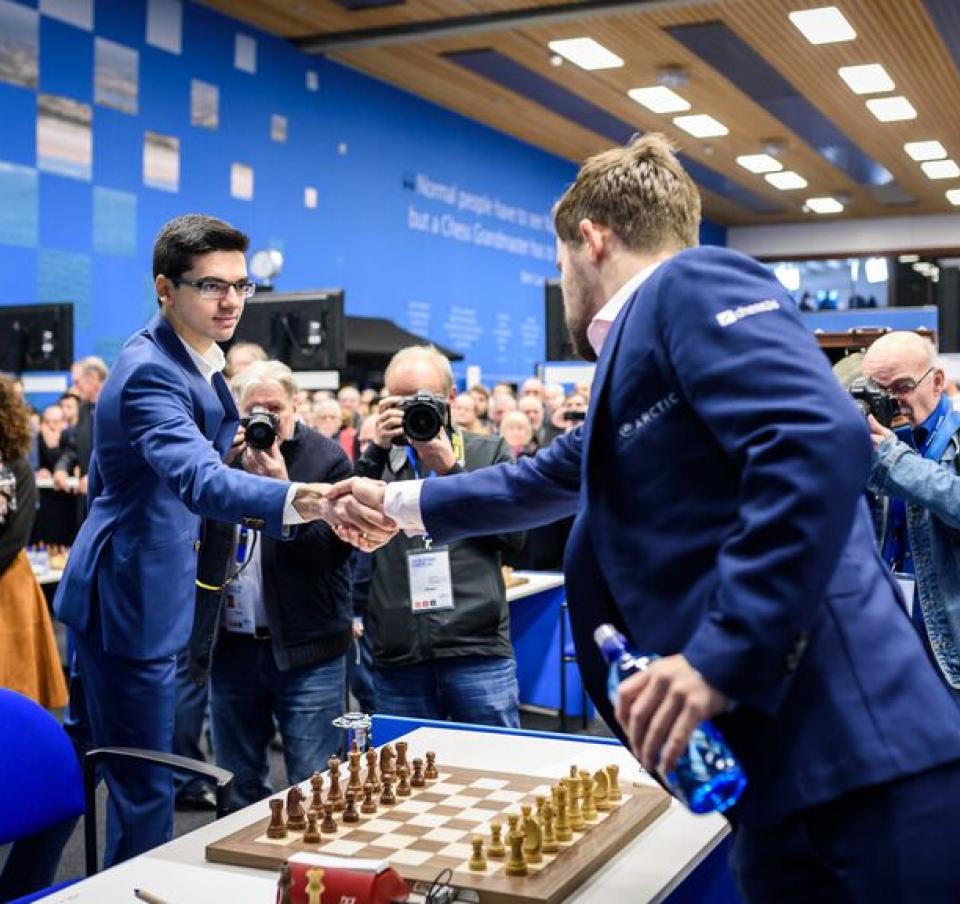 Two players shaking hands as the Tata Steel chess tournament round 1-3