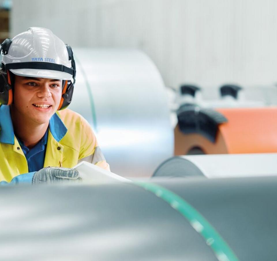 Tata Steel apprentice measuring a steel coil