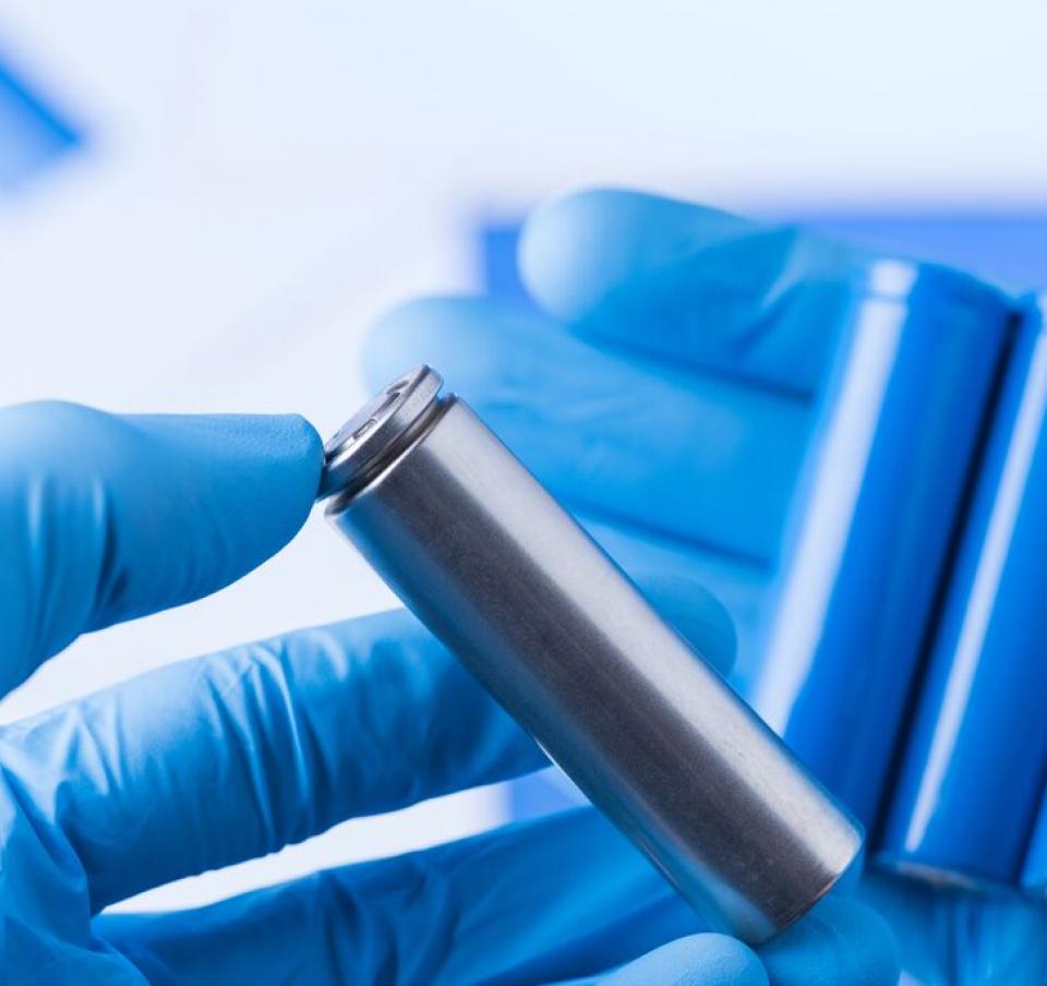 Ion batteries in gloved hands