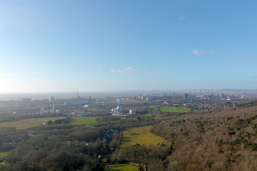 Aerial view of Port Talbot site and surrounding land from Margam, Neath Port Talbot 